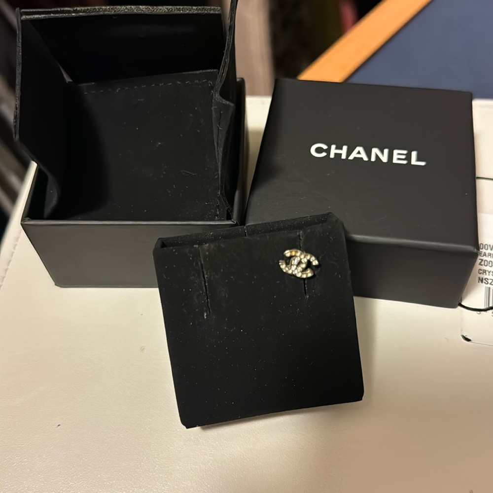 Singular Chanel earring. Missing some studs.